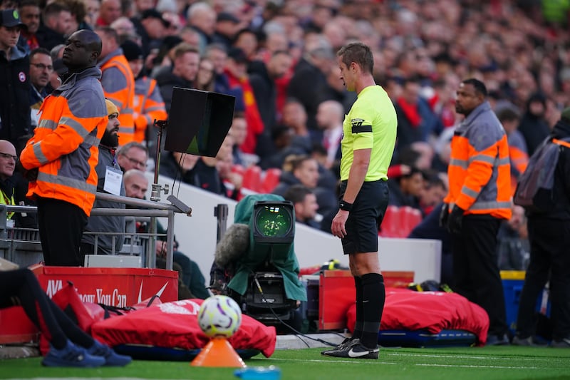 Referee John Brooks completes an on field VAR check to review a penalty. Photograph: Peter Byrne/PA 